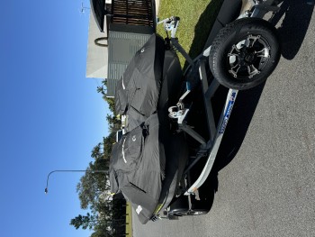 Two Sea-Doo jet Skis on dual trailer