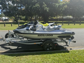 Two Sea-Doo jet Skis on dual trailer