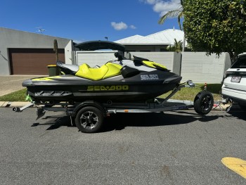 Two Sea-Doo jet Skis on dual trailer