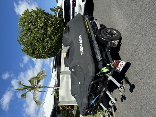 Two Sea-Doo jet Skis on dual trailer