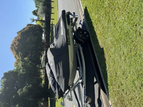 Two Sea-Doo jet Skis on dual trailer