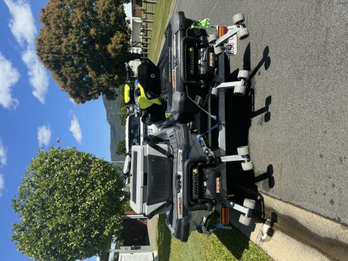 Two Sea-Doo jet Skis on dual trailer