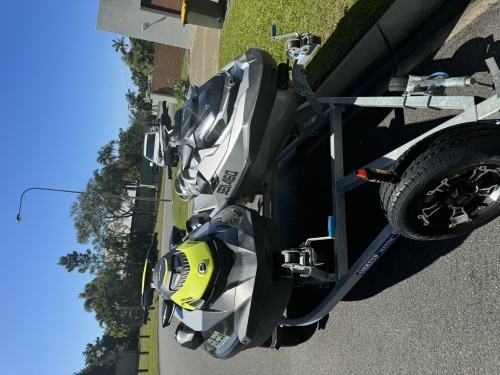 Two Sea-Doo jet Skis on dual trailer